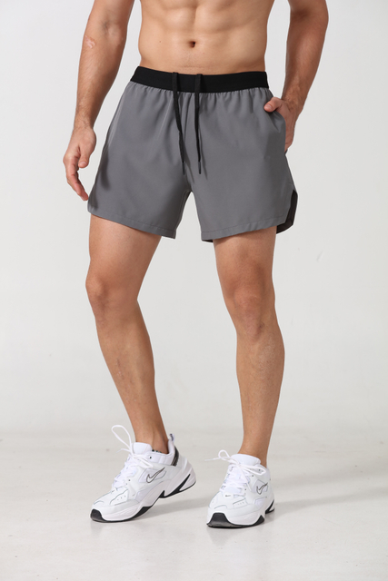 Shorts esportivos masculinos de spandex de poliéster seco rápido com bolsos laterais Fitness Workout Sports Sports Gym Mens Shorts